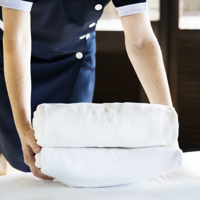 Housekeeper cleaning a hotel room